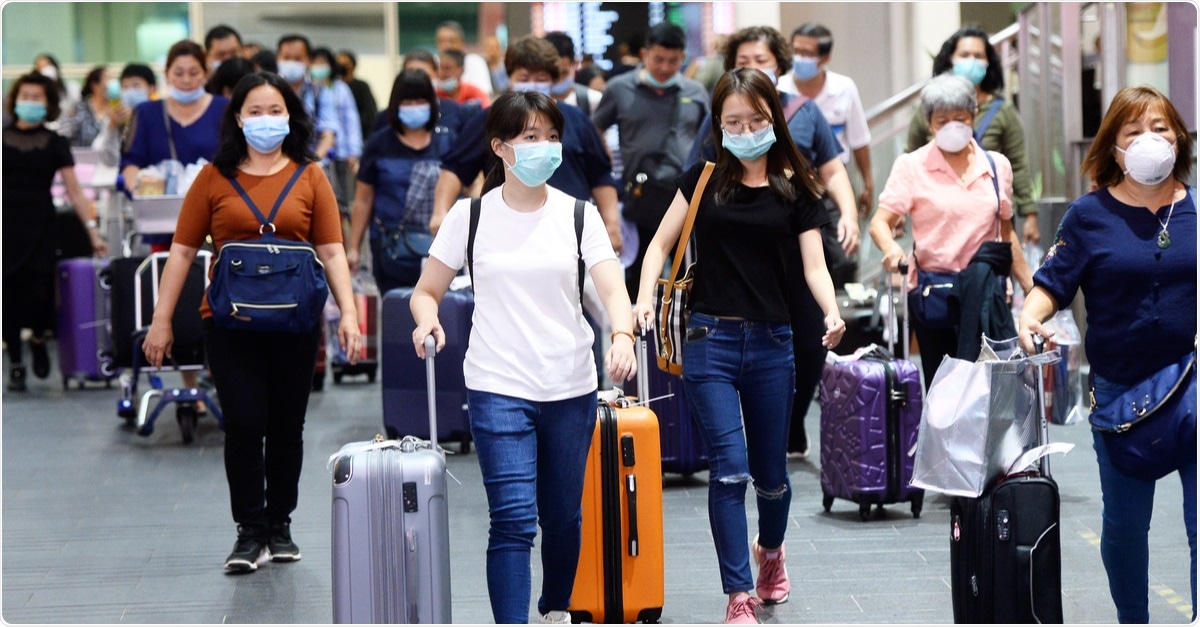 Travelers wear masks at Kuala Lumpur International Airport to prevent infection from coronavirus outbreak. February, 2020. Image Credit: Naufal Zaquan / Shutterstock