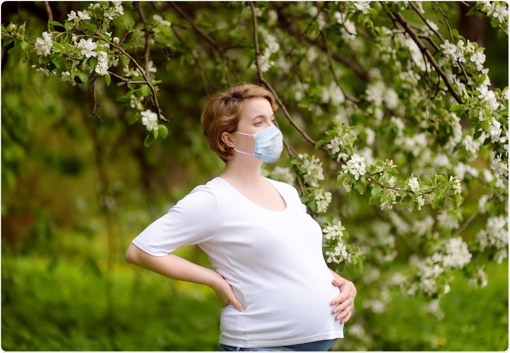 Pregnant woman wearing face mask